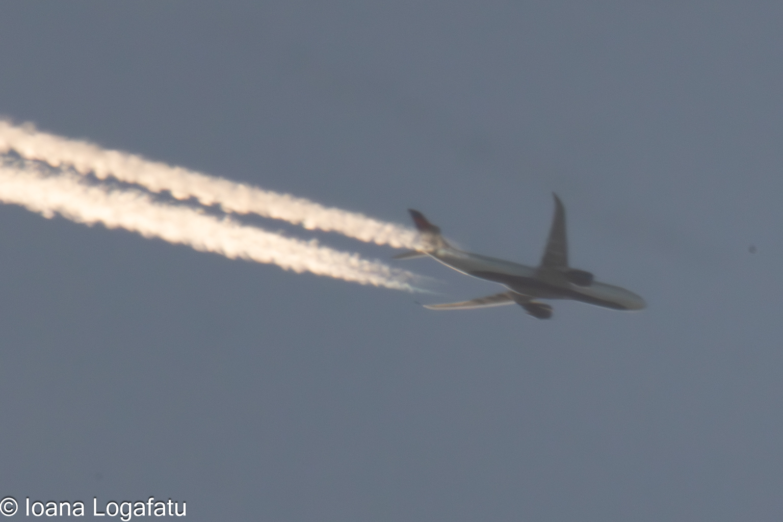 Aircraft soars through clear skies